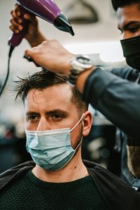 Traveling Barber Giving Haircut